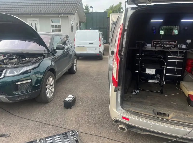 Range Rover Evoque next to the mobile workshop van